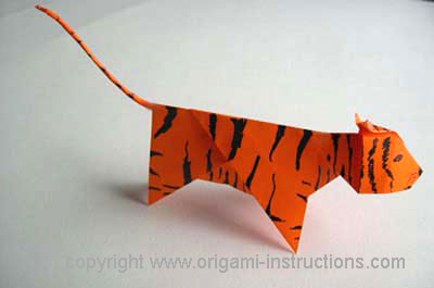 decorated origami tiger; stripes made with black marker